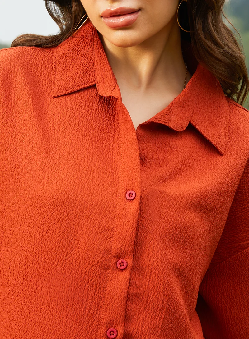 Campus Sutra  Women's Rust Orange Textured Oversized Shirt For Casual Wear | Spread Collar | Long Sleeve | Button Closure | Oversized Shirt Crafted With Comfort Fit For Everyday Wear for Women | Best Price UAE